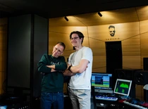 two people smiling in music studio