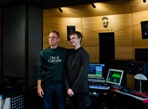 two people smiling in music studio